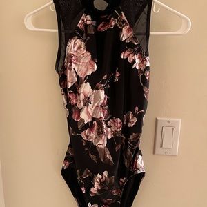 Floral dancewear solutions leotard with open back.